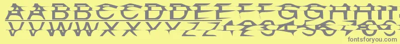 フォントMisplaced – 黄色の背景に灰色の文字