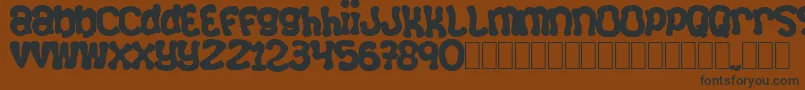 Squizzlie Font – Black Fonts on Brown Background