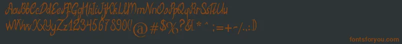 Шрифт MbElventypeFont – коричневые шрифты на чёрном фоне