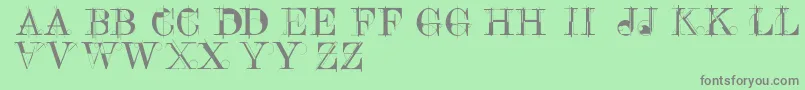 フォントConstrucaps – 緑の背景に灰色の文字