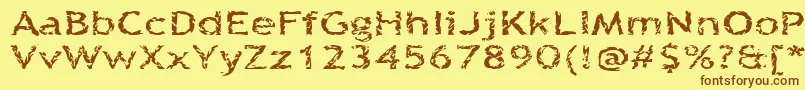 フォントQuinquefoliolate – 茶色の文字が黄色の背景にあります。