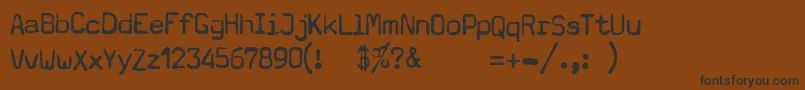 TypewriterA602DeadPostman2004 Font – Black Fonts on Brown Background