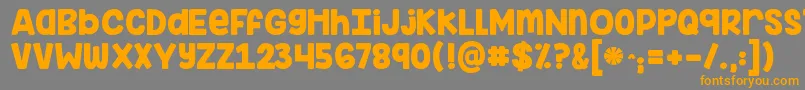 フォントKginimitableoriginal – オレンジの文字は灰色の背景にあります。
