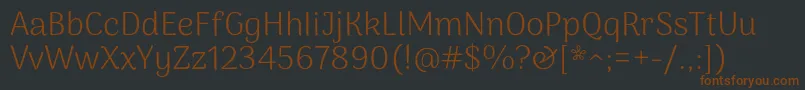 Czcionka ArimamaduraiLight – brązowe czcionki na czarnym tle