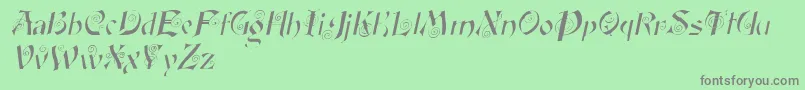 Fonte FairyscrolldisplayItalic – fontes cinzas em um fundo verde