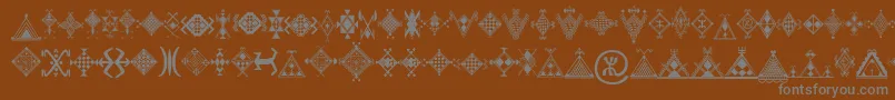 Mzmotifs Font – Gray Fonts on Brown Background
