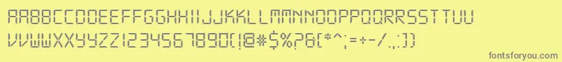 フォントDsDigital – 黄色の背景に灰色の文字