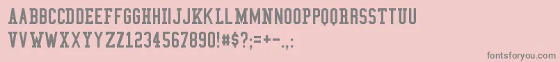 CollegeCondensed-fontti – harmaat kirjasimet vaaleanpunaisella taustalla