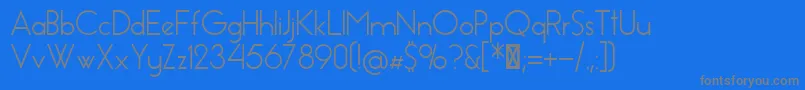 EssenceSans-fontti – harmaat kirjasimet sinisellä taustalla