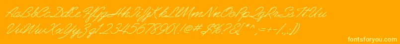 Czcionka AbrazoScriptSsiItalic – żółte czcionki na pomarańczowym tle