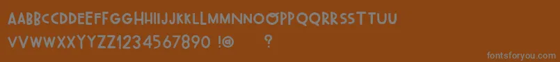 Fonte OhWonderfulRegularDemo – fontes cinzas em um fundo marrom