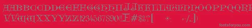 Fonte GeschlossenGotikKaps – fontes cinzas em um fundo vermelho