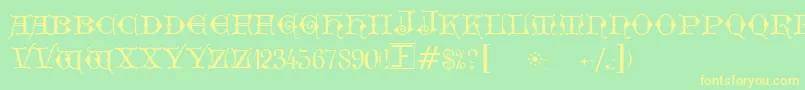 フォントGeschlossenGotikKaps – 黄色の文字が緑の背景にあります