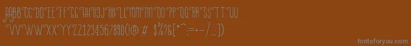LaPetitenget Font – Gray Fonts on Brown Background