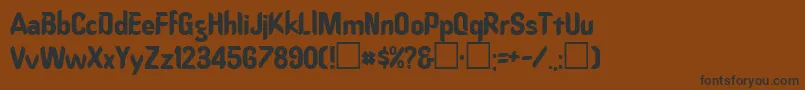 フォントOrd ffy – 黒い文字が茶色の背景にあります