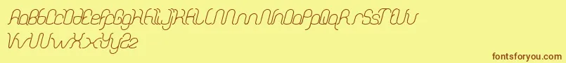 DolphinOceanWave Font – Brown Fonts on Yellow Background