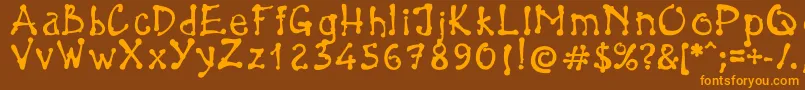 フォントBrokenPen – オレンジ色の文字が茶色の背景にあります。