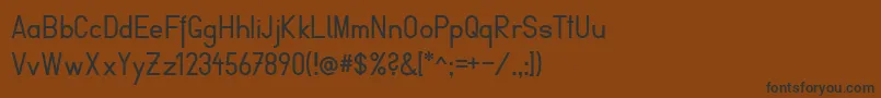 FibelVienna Font – Black Fonts on Brown Background