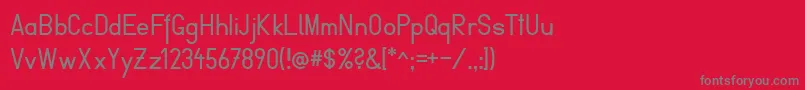 FibelVienna-Schriftart – Graue Schriften auf rotem Hintergrund