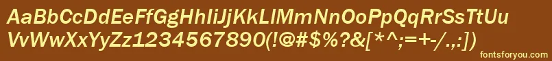 ItcFranklinGothicLtMediumItalic-fontti – keltaiset fontit ruskealla taustalla