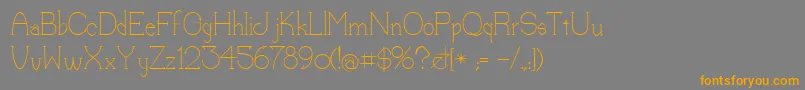 フォントLorena – オレンジの文字は灰色の背景にあります。