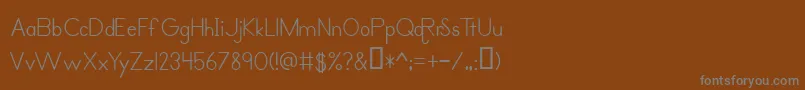 フォントPrimerPrintRegular – 茶色の背景に灰色の文字