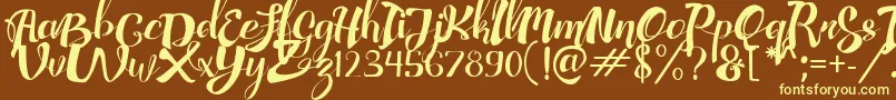 AdefebiaFreeFont Font – Yellow Fonts on Brown Background