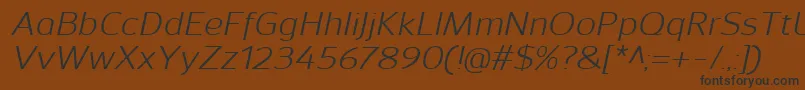SavileItalic-fontti – mustat fontit ruskealla taustalla