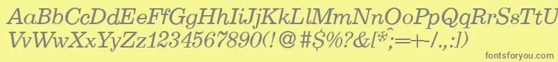 E710RomanItalic Font – Gray Fonts on Yellow Background