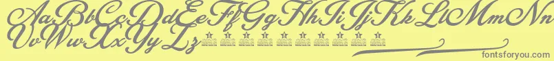 BlessedPersonalUse-fontti – harmaat kirjasimet keltaisella taustalla
