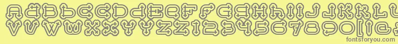 BeltermegaoutlineitcTt-Schriftart – Graue Schriften auf gelbem Hintergrund