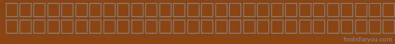 QuiverRegular-Schriftart – Graue Schriften auf braunem Hintergrund