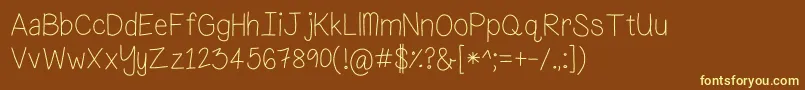 What...FishDied-fontti – keltaiset fontit ruskealla taustalla