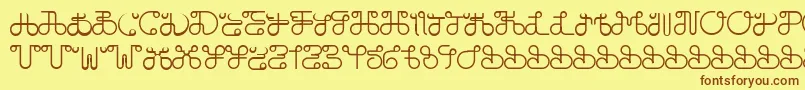 フォントDobilasSteady – 茶色の文字が黄色の背景にあります。