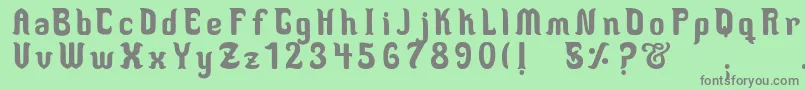 フォントMedusaScript – 緑の背景に灰色の文字