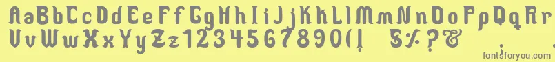 フォントMedusaScript – 黄色の背景に灰色の文字