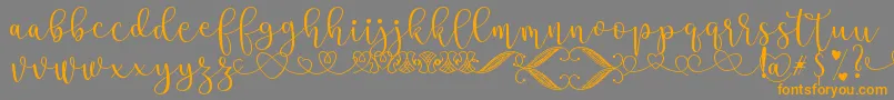 SteaFont Font – Orange Fonts on Gray Background