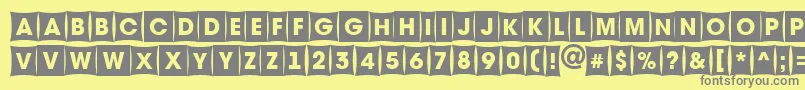 AAvantetitulcmfsh-fontti – harmaat kirjasimet keltaisella taustalla