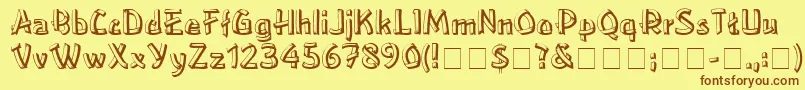 フォントLowereastsideMedium – 茶色の文字が黄色の背景にあります。