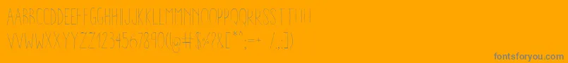AracneCondensedLight-fontti – harmaat kirjasimet oranssilla taustalla