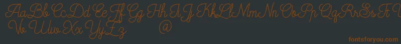 Mooglonk-Schriftart – Braune Schriften auf schwarzem Hintergrund