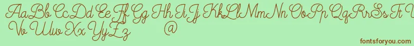 Mooglonk-Schriftart – Braune Schriften auf grünem Hintergrund