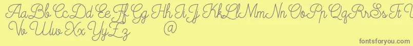 Mooglonk-Schriftart – Graue Schriften auf gelbem Hintergrund