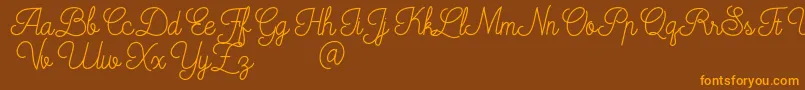 Czcionka Mooglonk – pomarańczowe czcionki na brązowym tle
