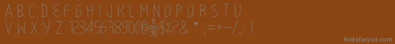 LightyCre-Schriftart – Graue Schriften auf braunem Hintergrund