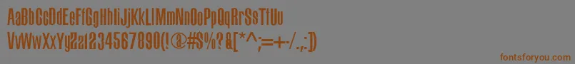 フォントBigdog – 茶色の文字が灰色の背景にあります。