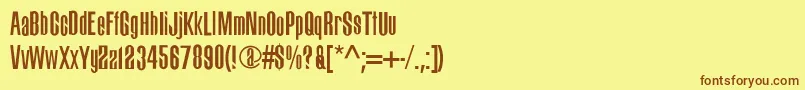 フォントBigdog – 茶色の文字が黄色の背景にあります。