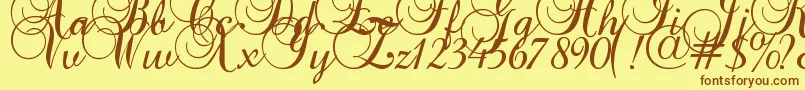 フォントBaroquescript – 茶色の文字が黄色の背景にあります。
