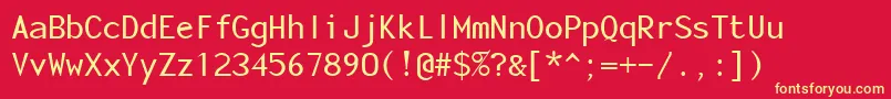 MonotonyMedium-Schriftart – Gelbe Schriften auf rotem Hintergrund