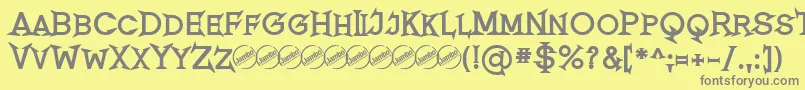 フォントRomanicumBold – 黄色の背景に灰色の文字